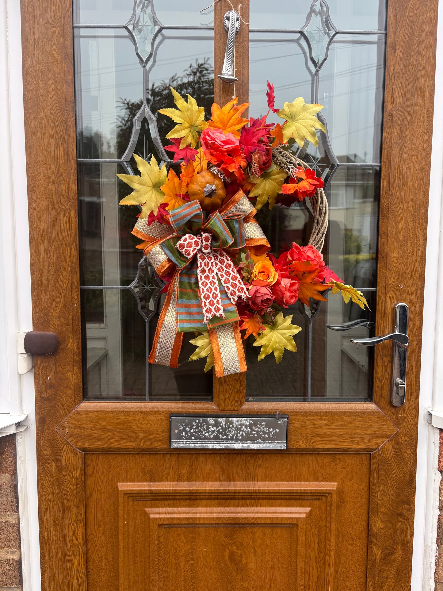 Autumn Wreath: Orange Roses, Maple Leaves & Pumpkin - Grey Wicker Door Decor